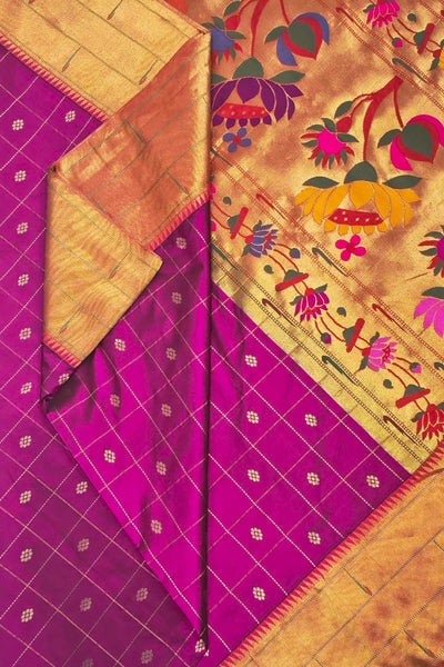 Paithani pure silk saree in purple with checks & buttis on the body .