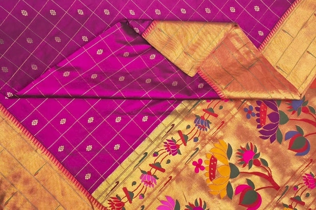 Handwoven Paithani pure silk saree in purple with checks & buttis on the body .