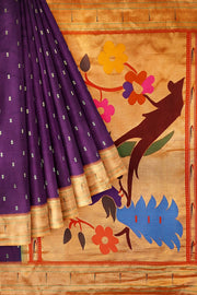 Paithani pure silk saree in wine with  buttis on the body .