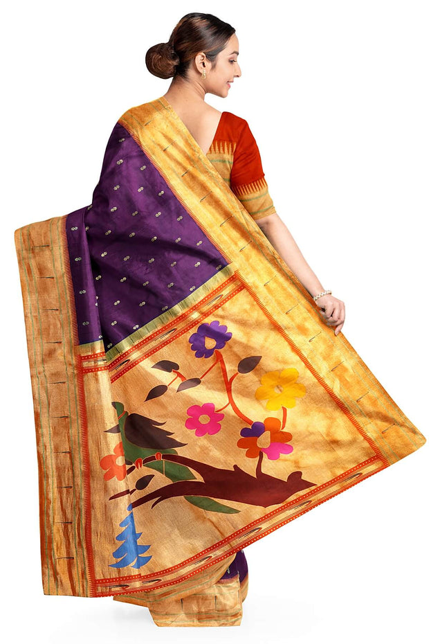 Paithani pure silk saree in wine with  buttis on the body .