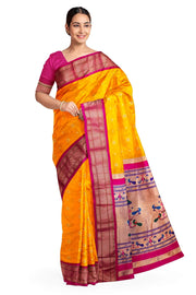 Paithani pure silk saree in mango yellow with small buttis all over the body