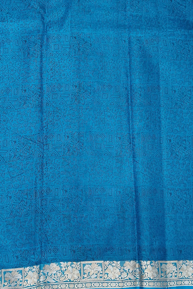 Printed pure silk saree in copper sulphate blue