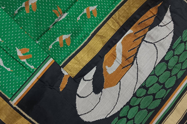 Handwoven Patola pure silk saree in green  with bird motifs