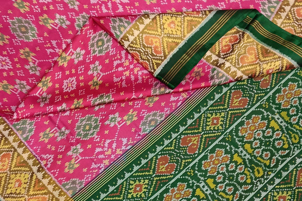 Handwoven Patola pure silk saree in pink in navratan pattern