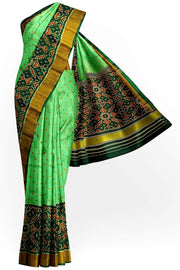 Handwoven Patola pure silk saree in green with small motifs and a skirt border