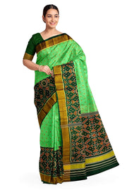 Handwoven Patola pure silk saree in green with small motifs and a skirt border