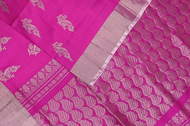 Handwoven Uppada pure silk saree in rani pink with floral motifs.