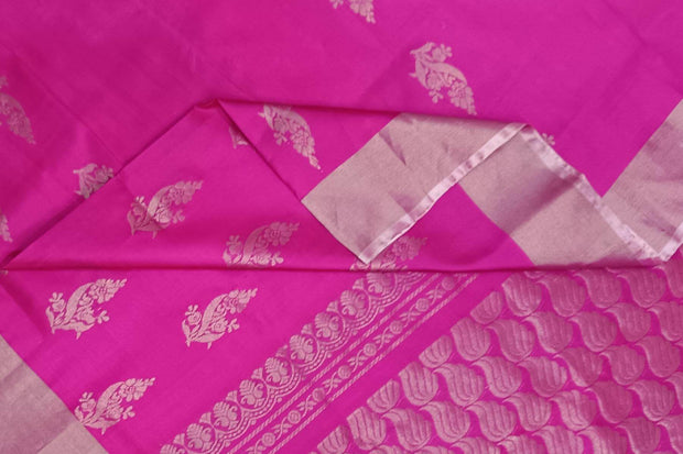 Handwoven Uppada pure silk saree in rani pink with floral motifs.