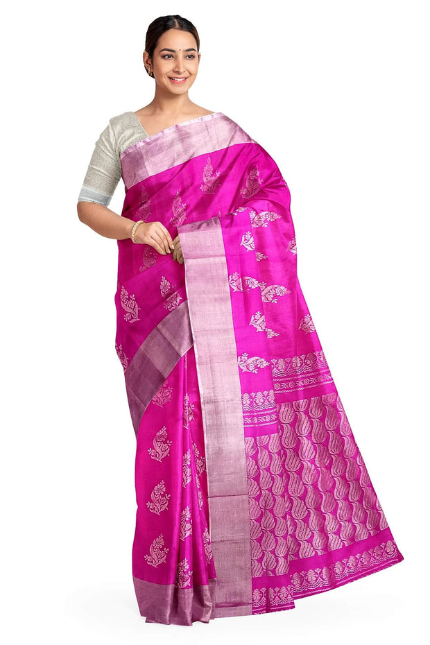 Handwoven Uppada pure silk saree in rani pink with floral motifs.