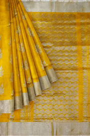 Handwoven Uppada pure silk saree in yellow with floral motifs .