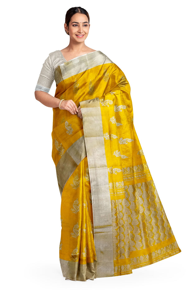 Handwoven Uppada pure silk saree in yellow with floral motifs .