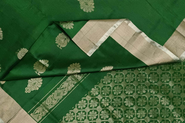 Handwoven Uppada pure silk saree in bottle green with floral motifs