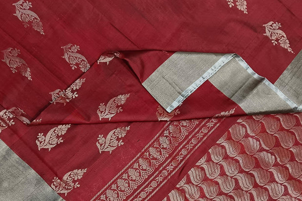 Handwoven Uppada pure silk saree in maroon with floral motifs.