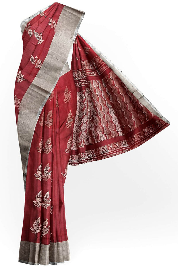 Handwoven Uppada pure silk saree in maroon with floral motifs.