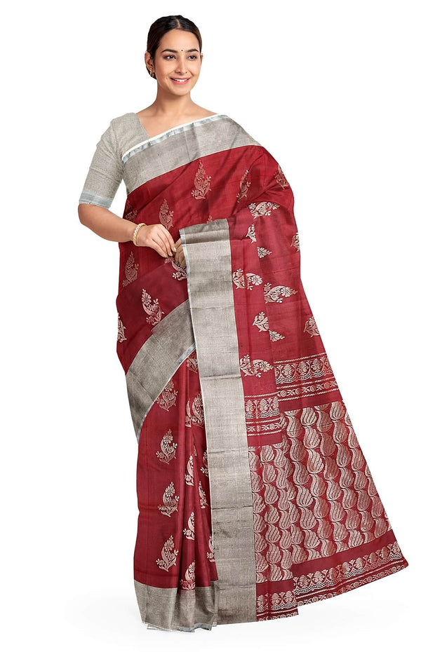 Handwoven Uppada pure silk saree in maroon with floral motifs.