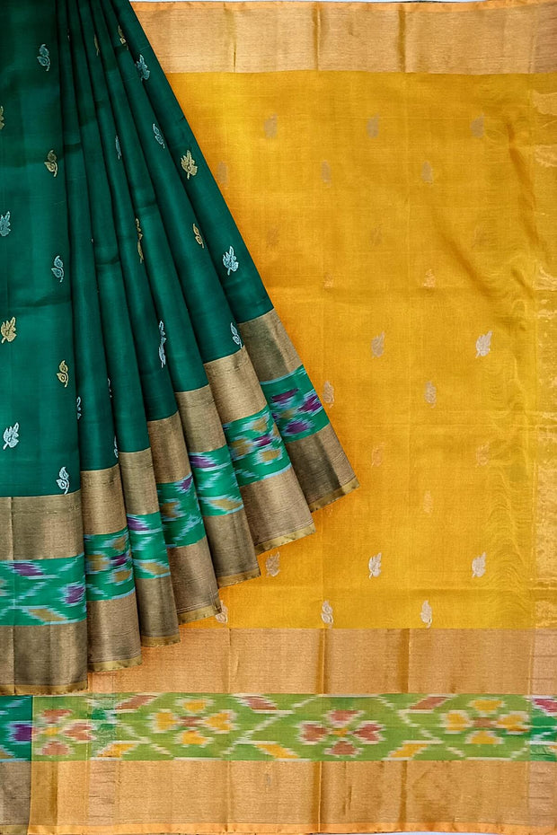 Handwoven Uppada pure silk saree in bottle green with Pochampally border.