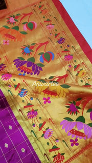 Paithani pure silk saree in purple with checks & buttis on the body .