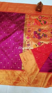 Paithani pure silk saree in purple with checks & buttis on the body .