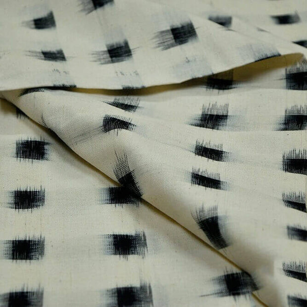 Handwoven double ikat pure cotton fabric in off white with black squares